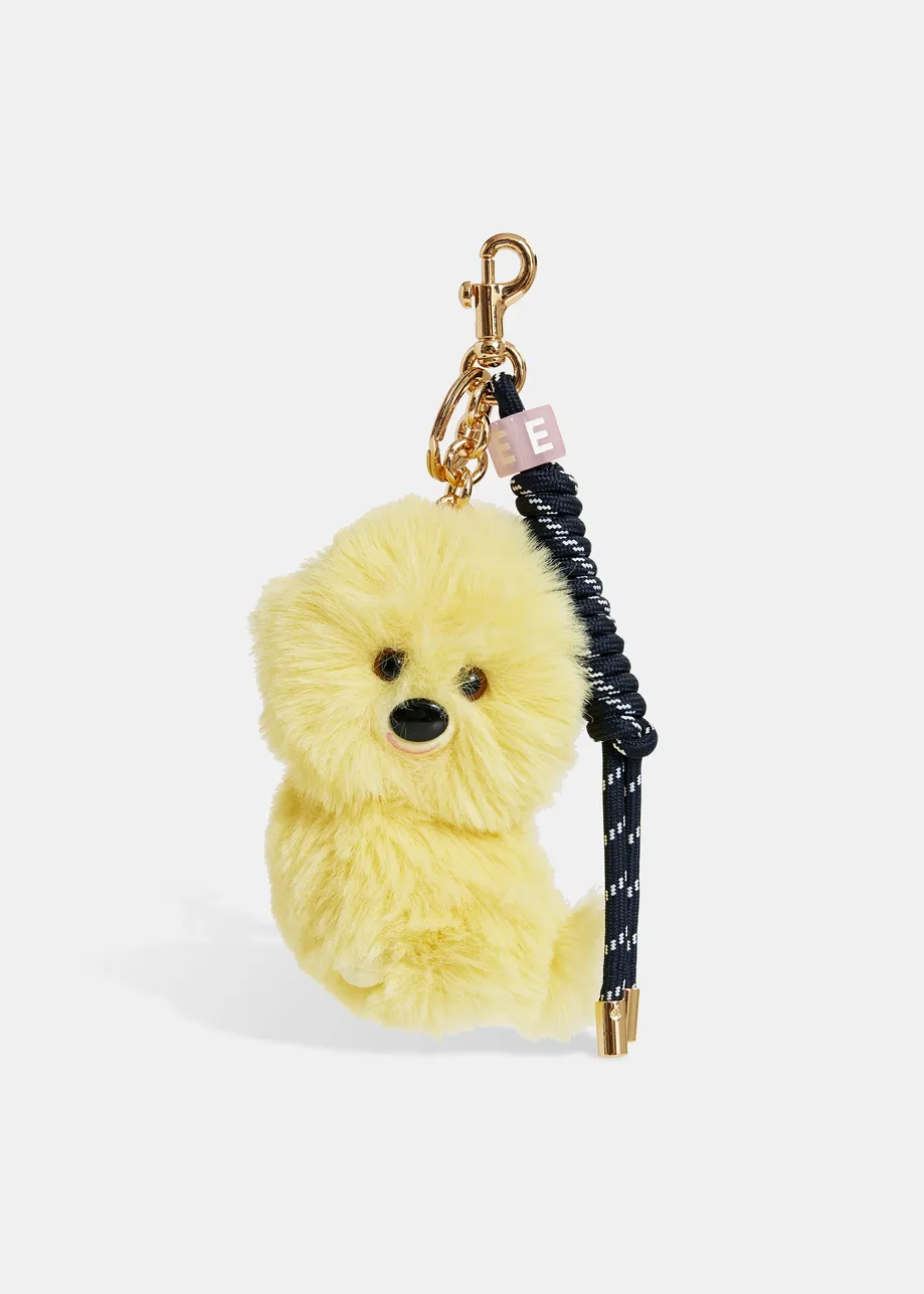 Yellow dog bag charm with black twisted cord detail