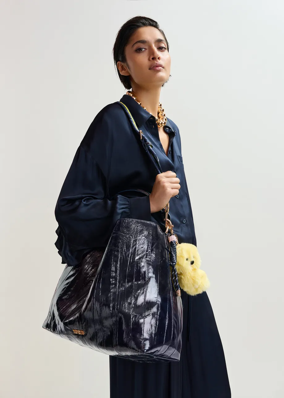 Yellow dog bag charm with black twisted cord detail