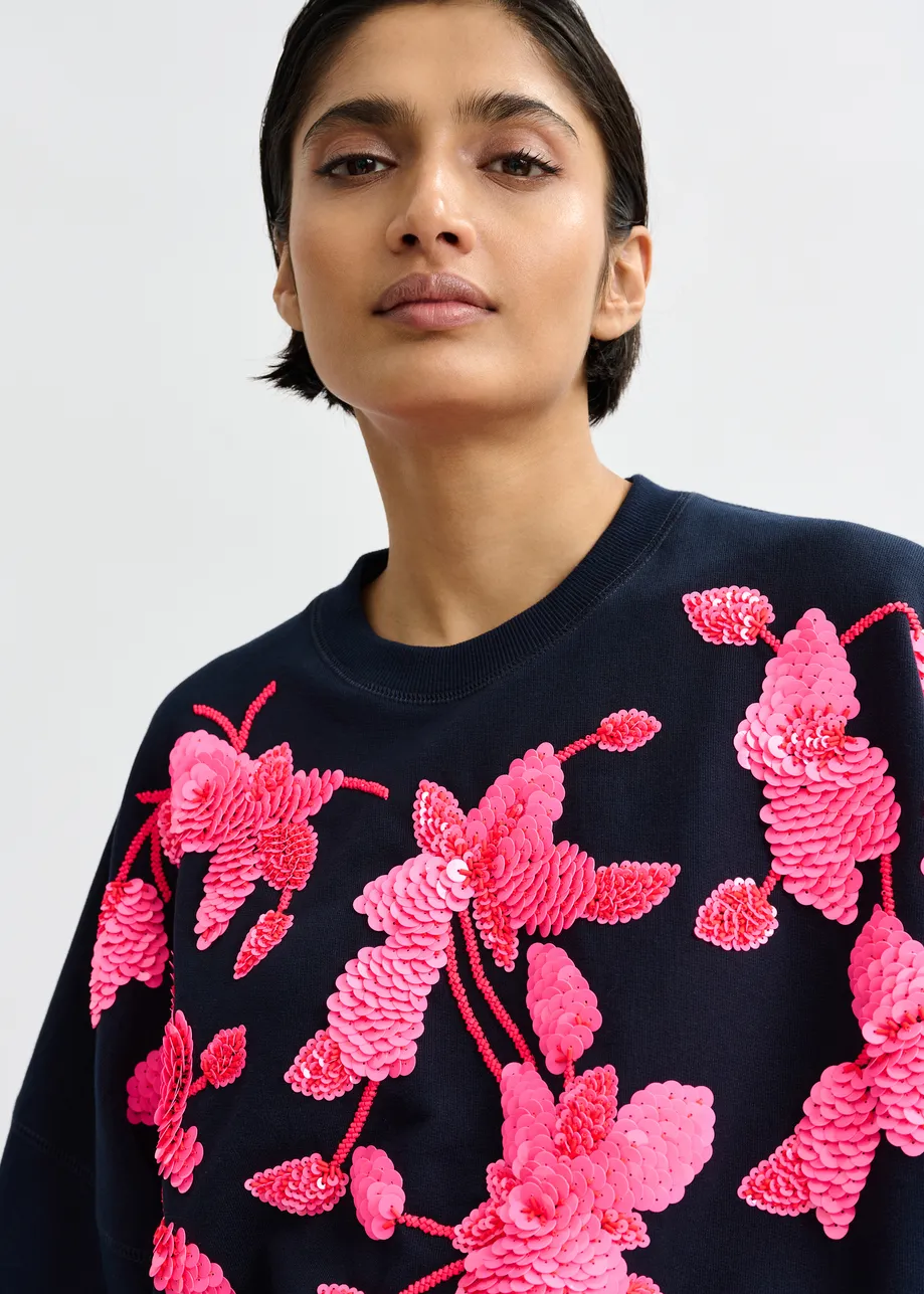 Marineblauwe katoenen sweater met roze bloemborduurwerk