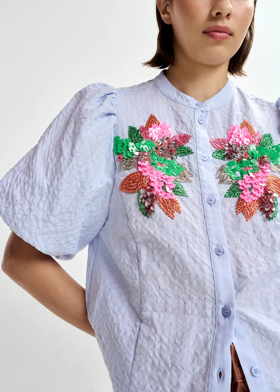 Light blue and multicolor floral sequin and bead-embellished shirt with voluminous sleeves