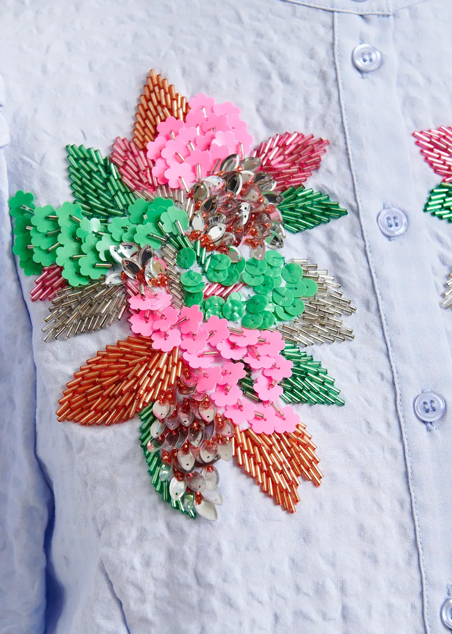 Light blue and multicolor floral sequin and bead-embellished shirt with voluminous sleeves