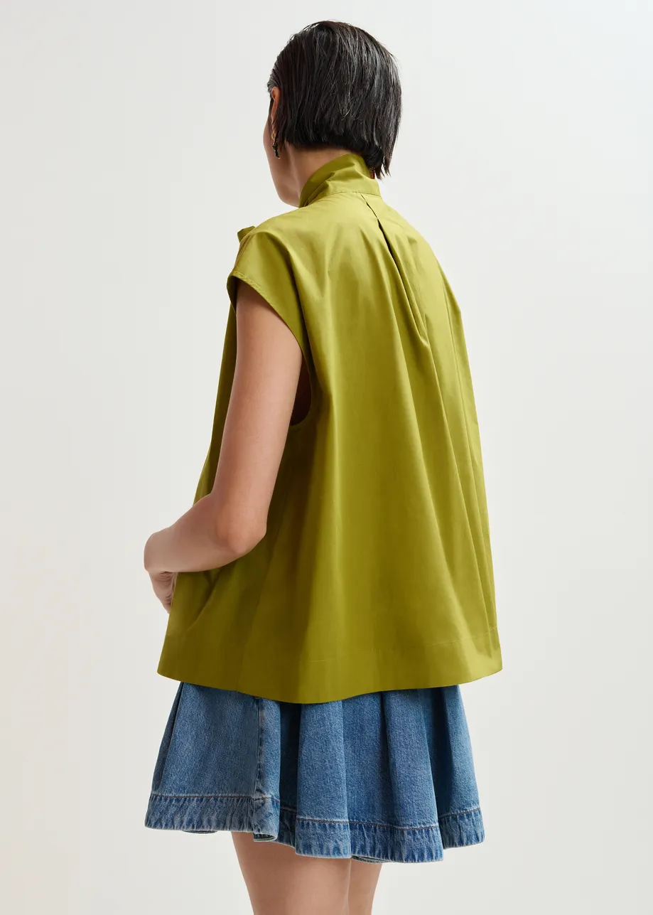 Maglia verde senza maniche con scollo a fiocco