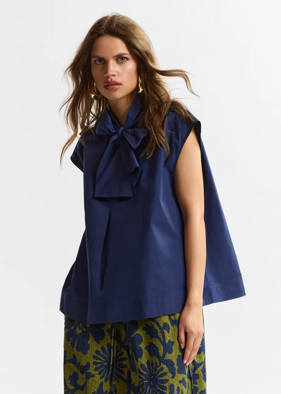 Navy sleeveless top with tie neckline