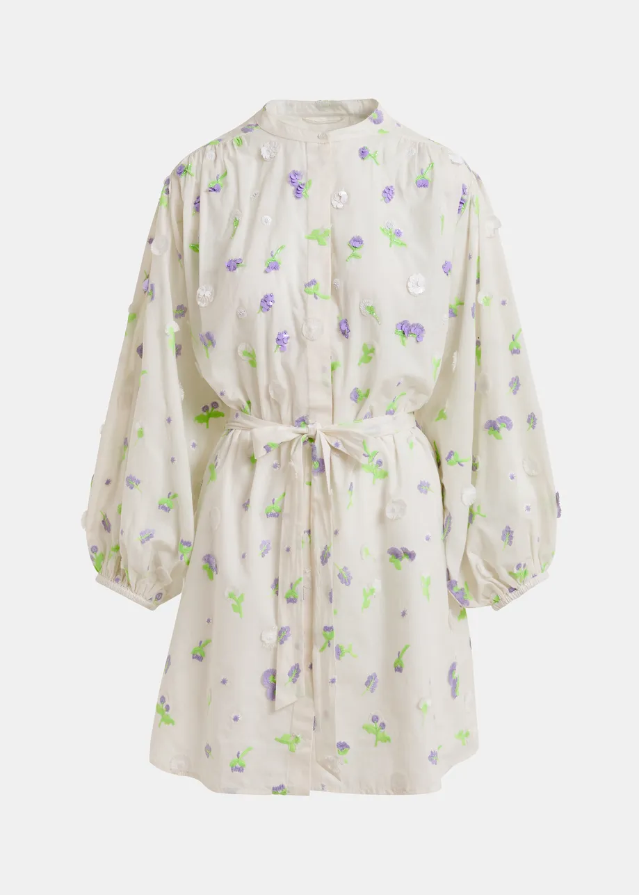 Off-white knee-length dress with mandarin collar and purple and green embellishments