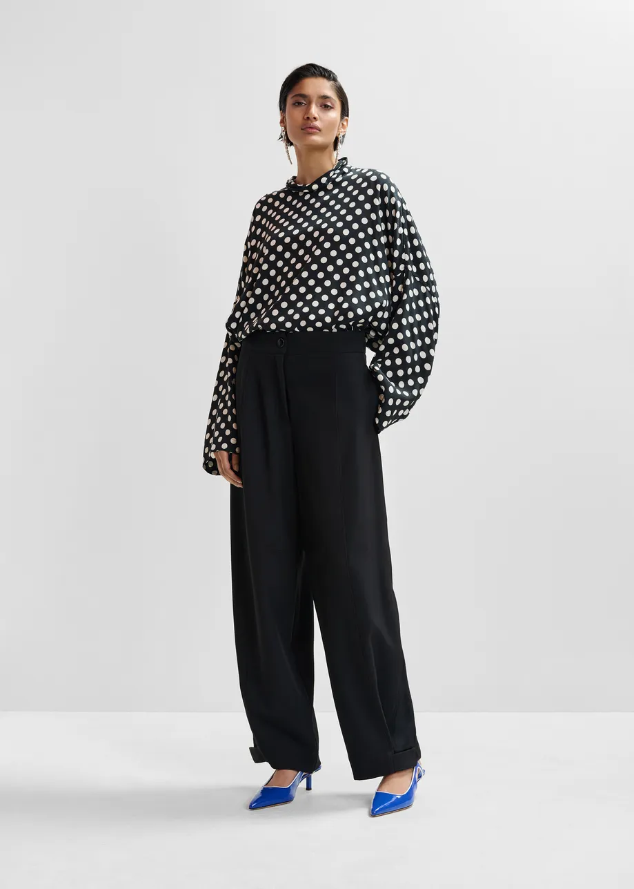 Black barrel-leg pants with twisted side seams