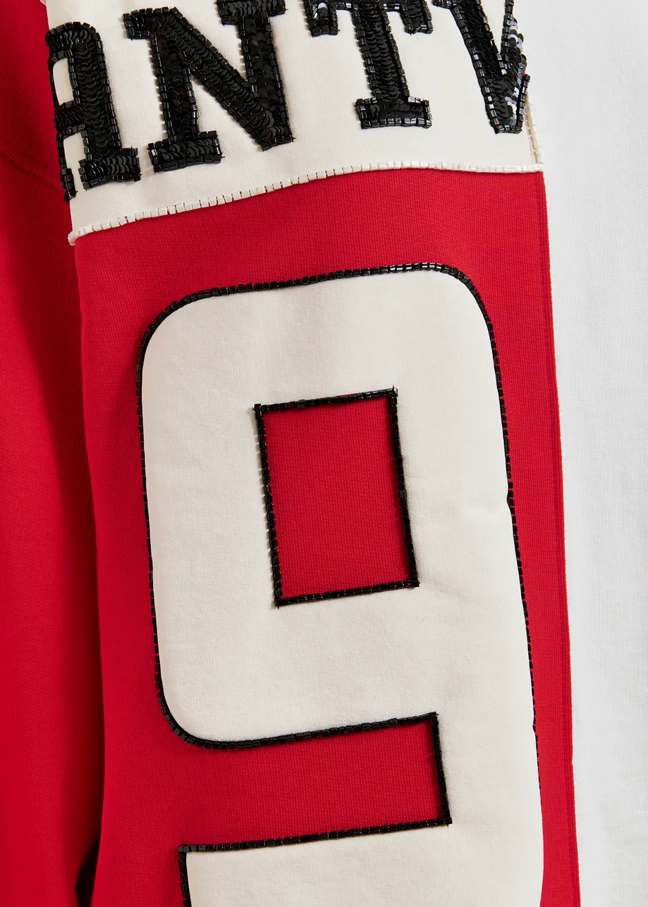 Rode en witte sweater van 2 helften met appliques