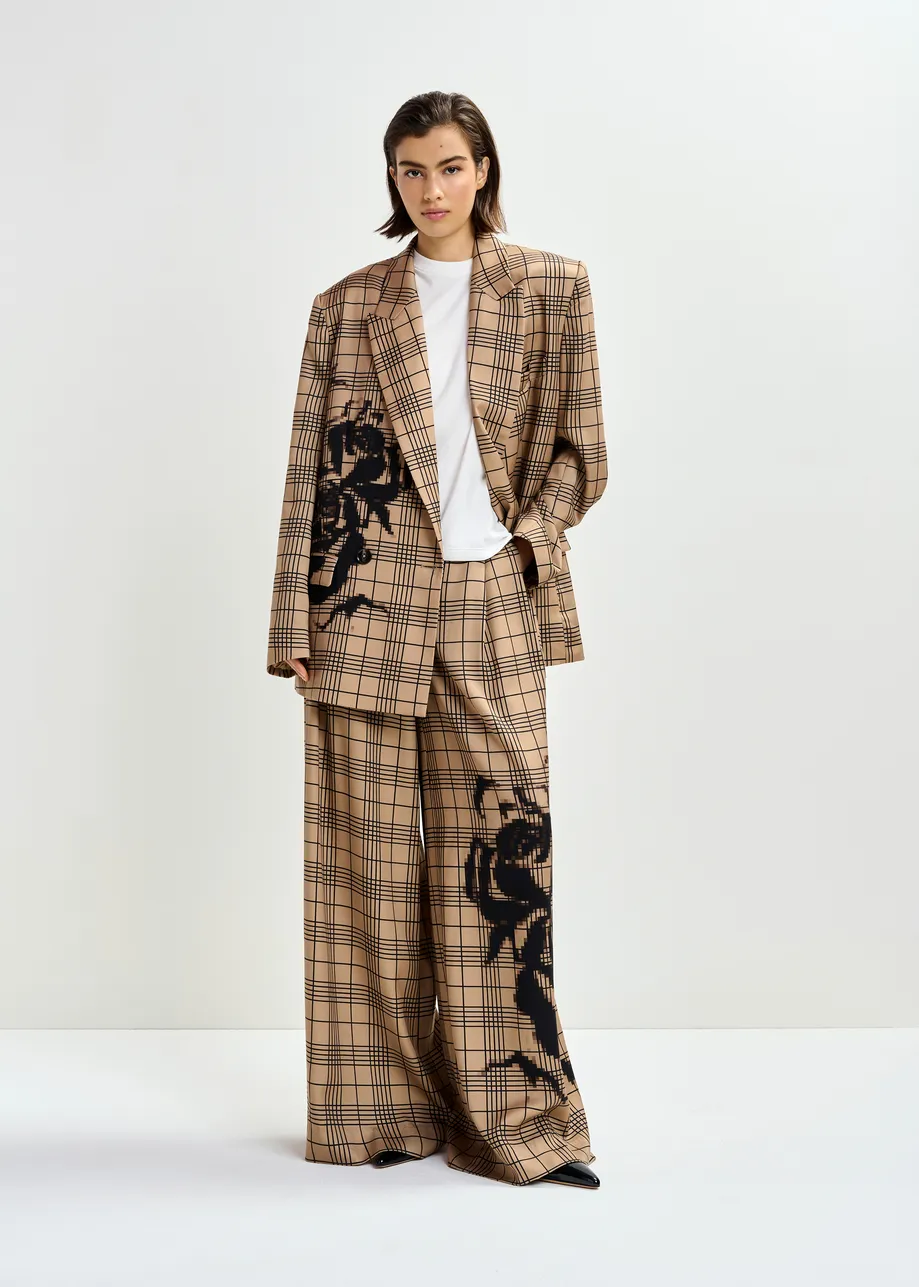 Bruin en zwart geruite broek met brede pijp en geplaatste print