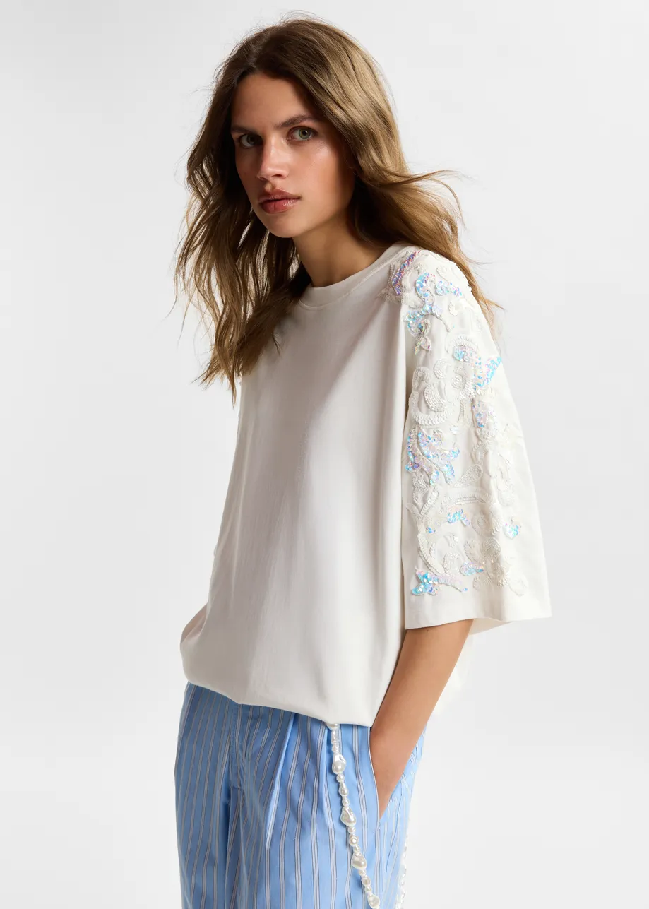 Off-white cotton T-shirt with sequin and bead embellishments