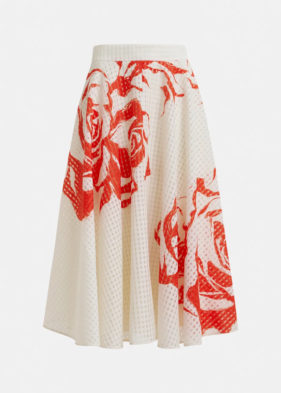 Jupe mi-longue plissée blanc cassé et rouge à fleurs