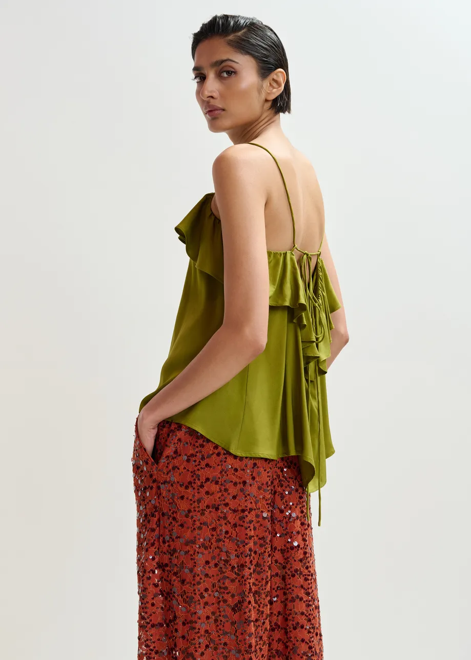 Groen topje met volant en lint op de rug