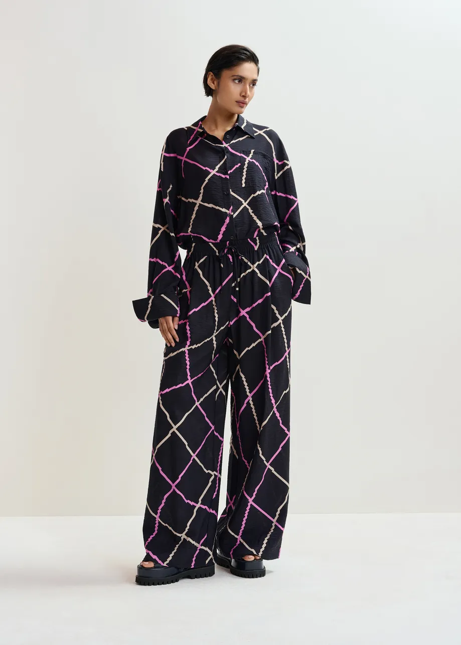 Zwart, roze en beige geruite broek met brede pijp