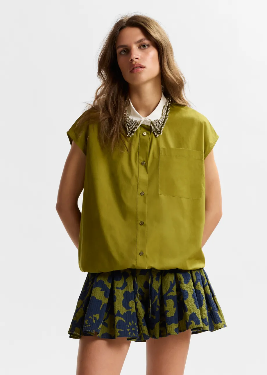 Green sleeveless cotton shirt with embellished collar