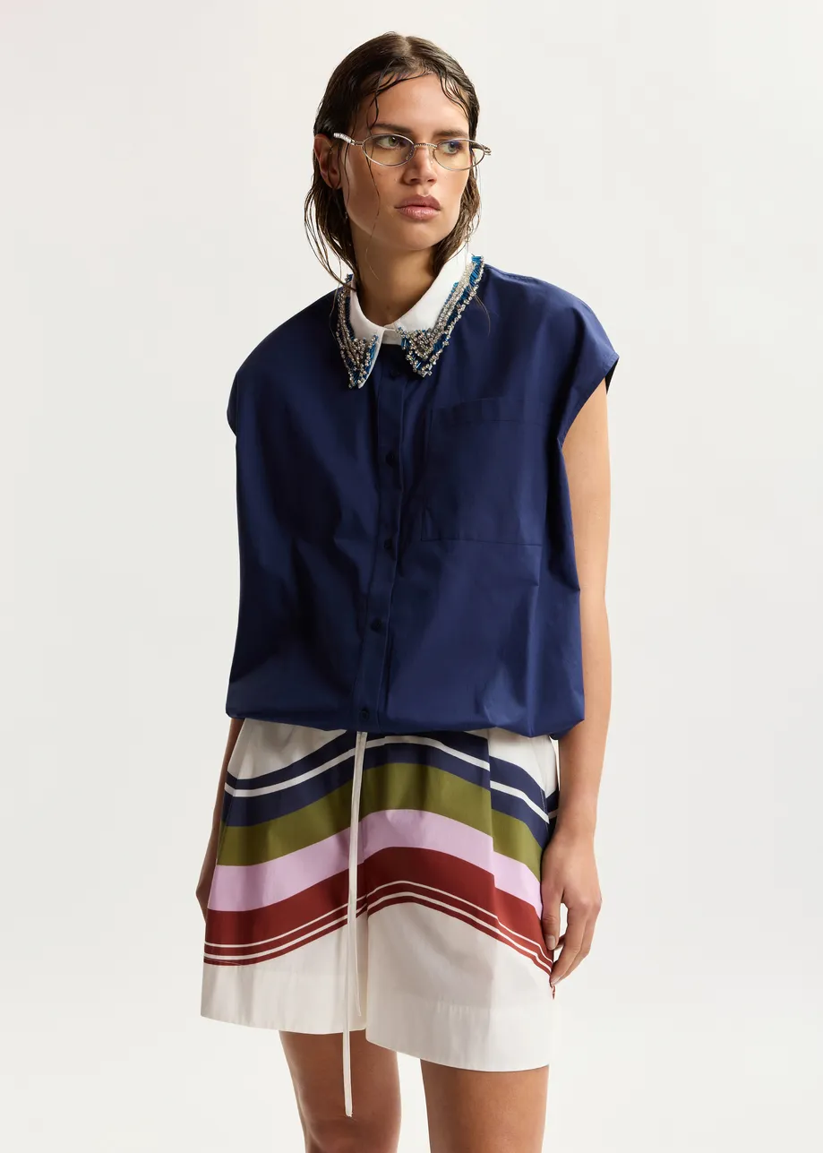 Navy sleeveless cotton shirt with embellished collar