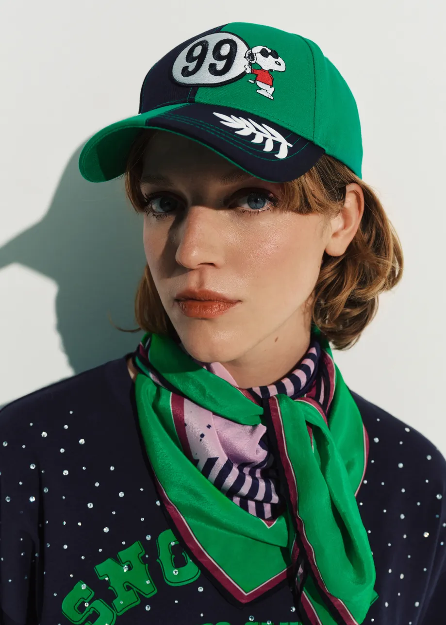 Green, black and white Peanuts™ Snoopy color-block cotton cap