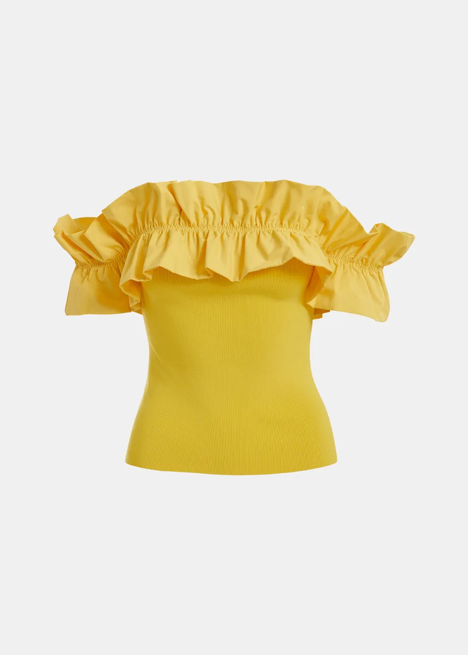 Yellow off-shoulder knit top with ruffle trim