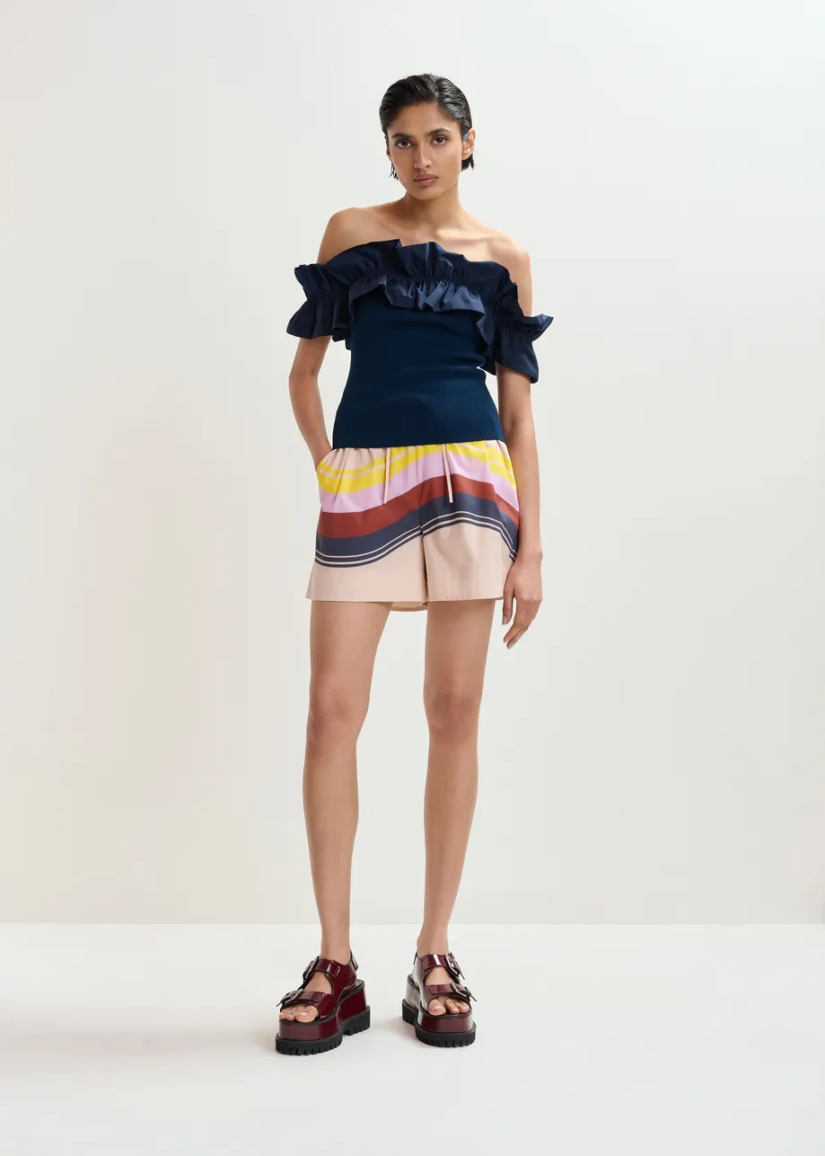 Donkerblauwe gebreide top met blote schouders en volant