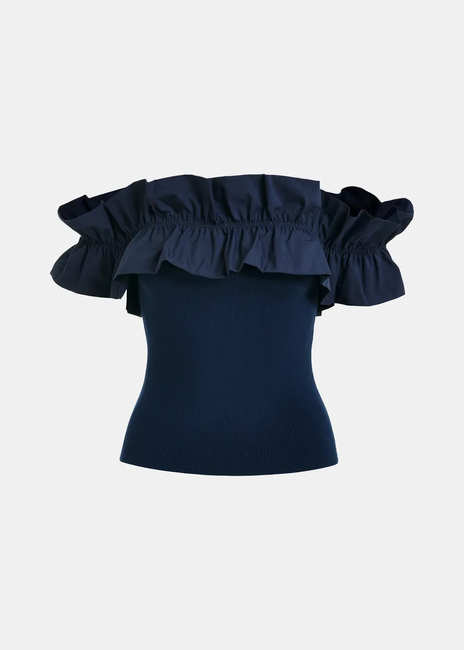 Top in maglia blu scuro con spalle scoperte e volant