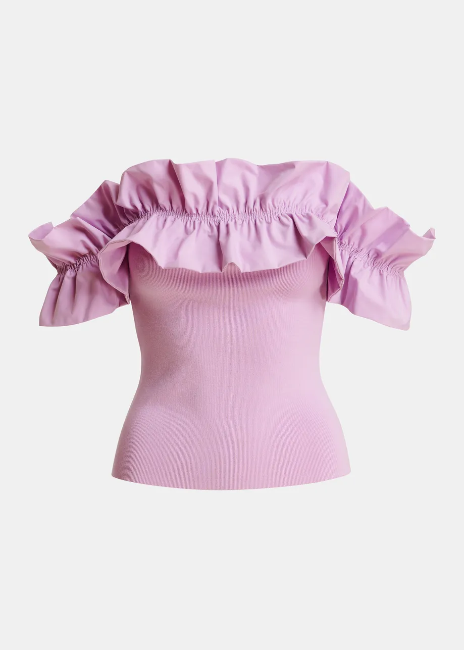 Light pink off-shoulder knit top with ruffle trim