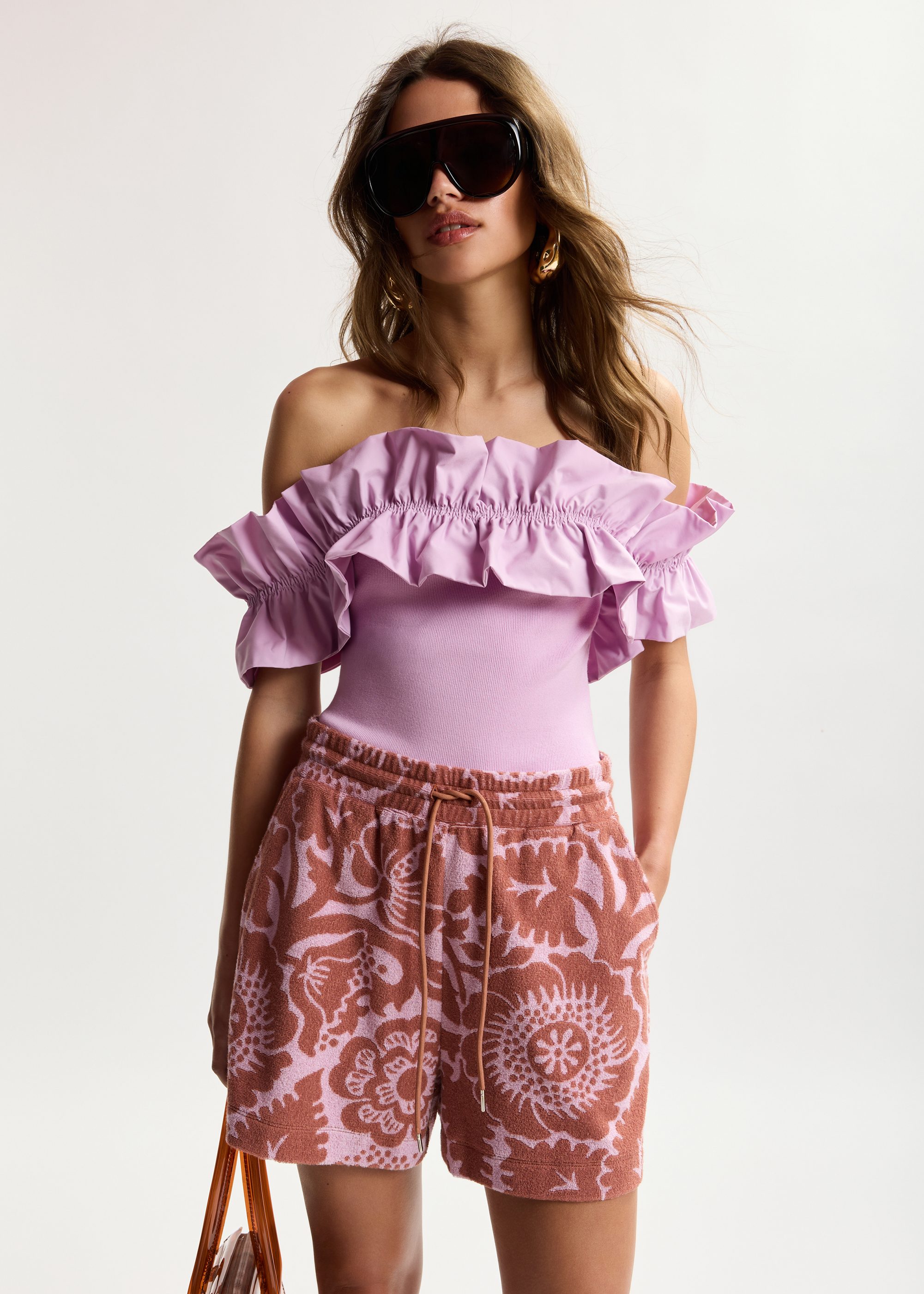 Light pink off-shoulder knit top with ruffle trim | Essentiel