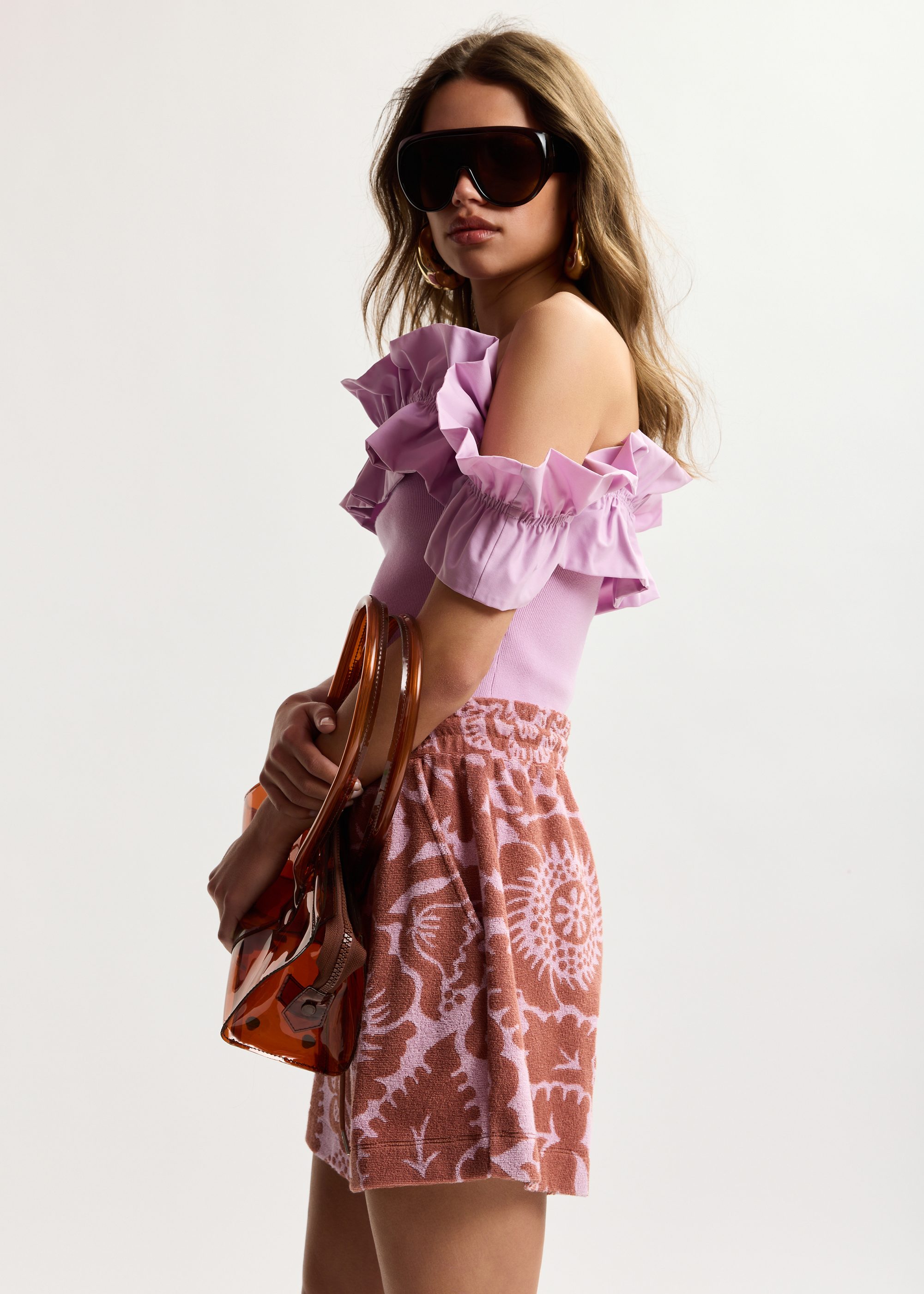 Light pink off-shoulder knit top with ruffle trim | Essentiel