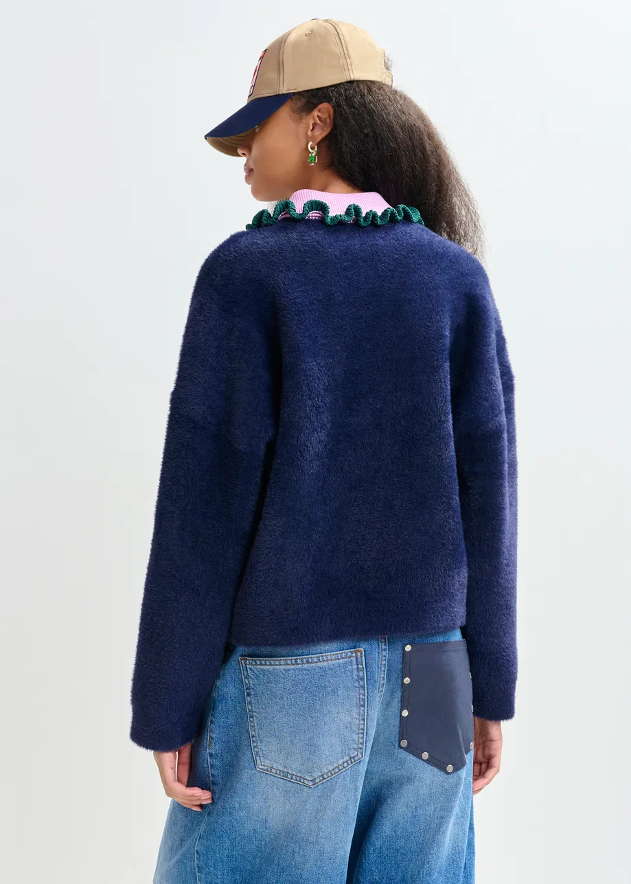 Navy cardigan with contrasting purple and dark green ruffle collar