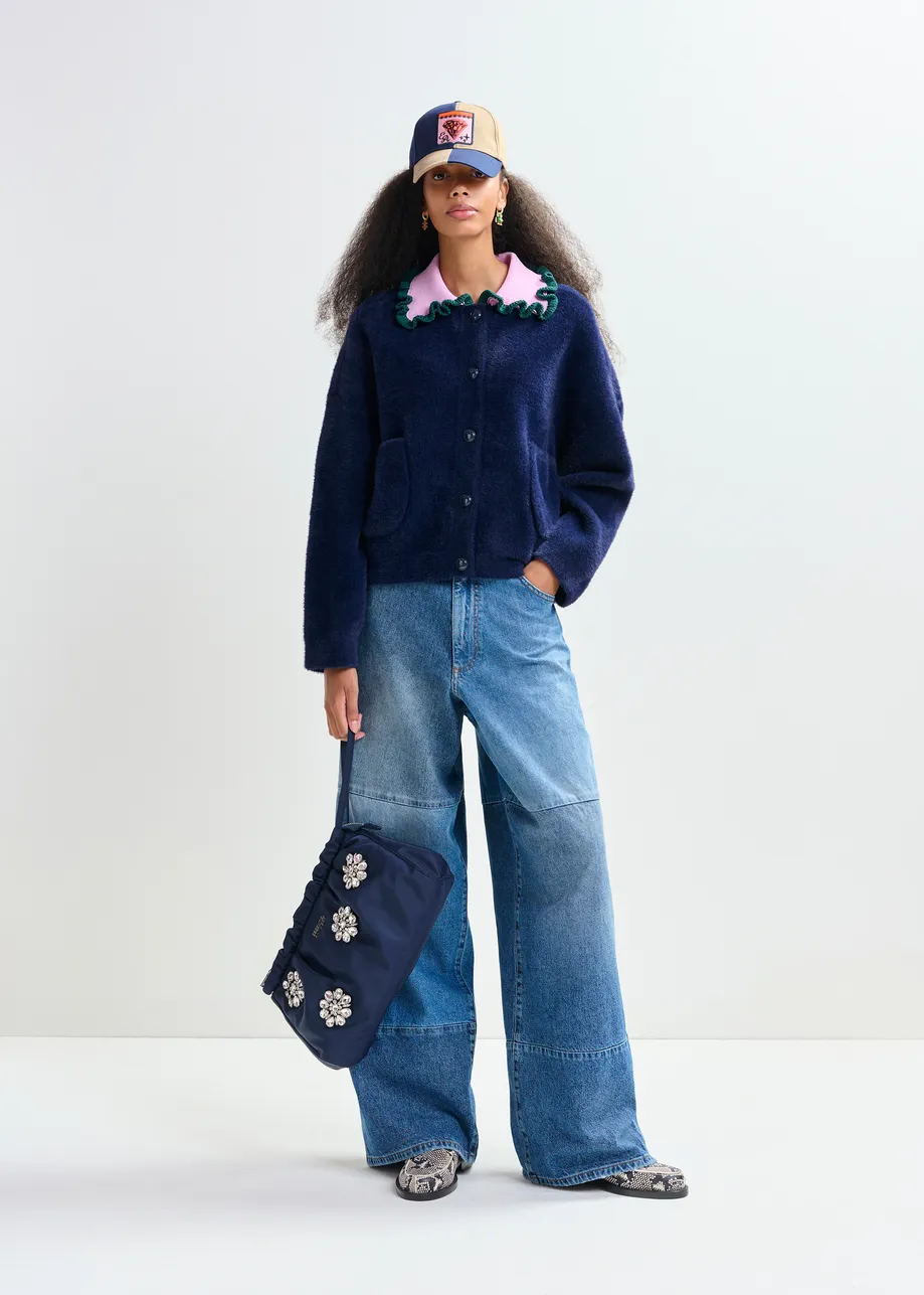 Navy cardigan with contrasting purple and dark green ruffle collar