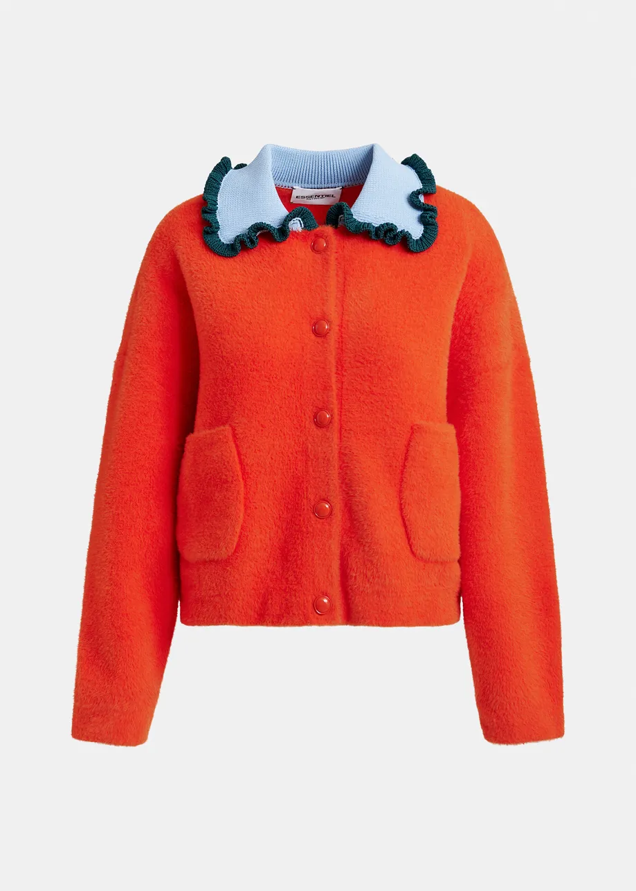 Orange cardigan with contrasting light blue and dark green ruffle collar
