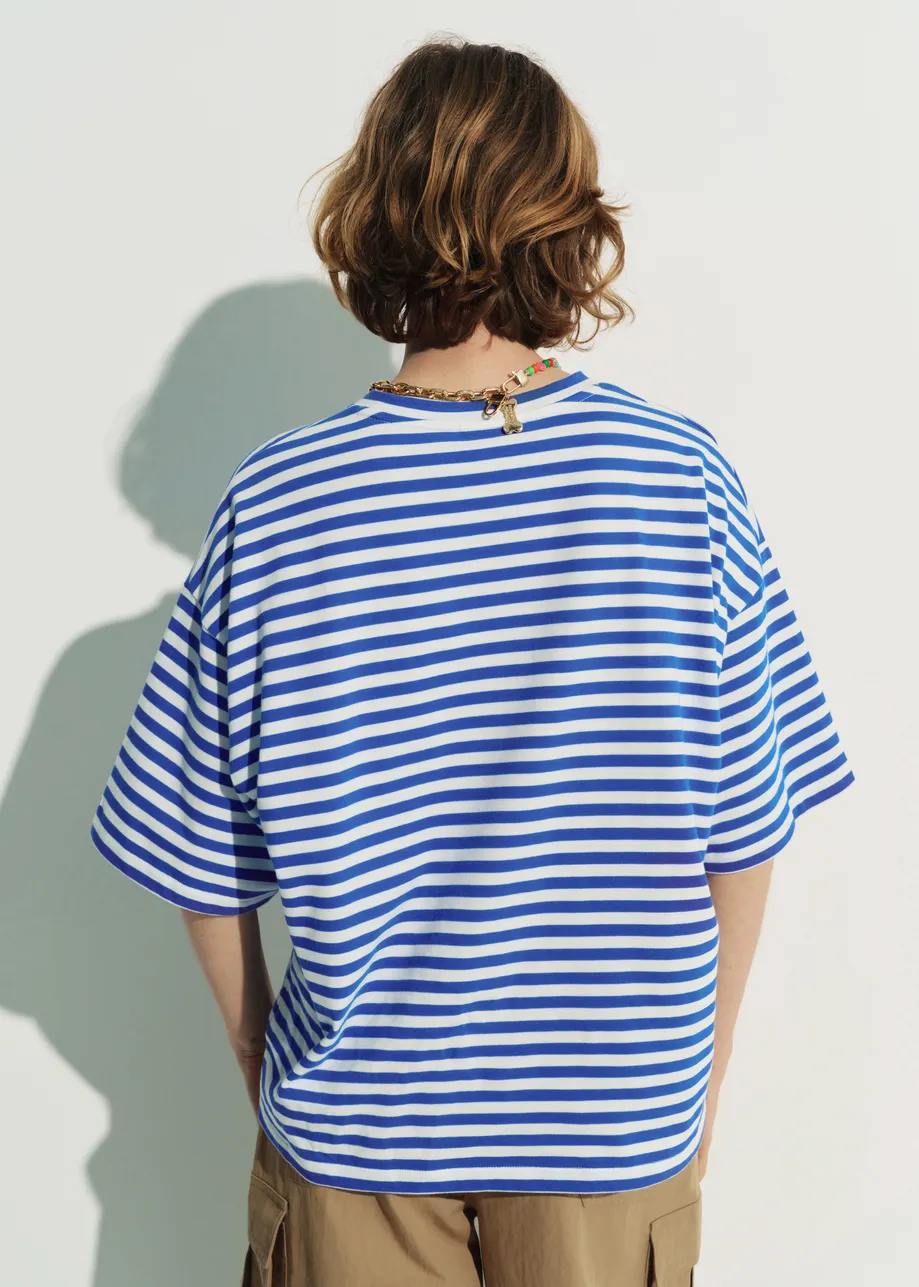 Blue and off-white striped T-shirt with yellow Peanuts™ Woodstock detail
