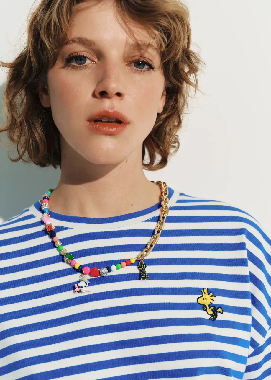 Blue and off-white striped T-shirt with yellow Peanuts™ Woodstock detail