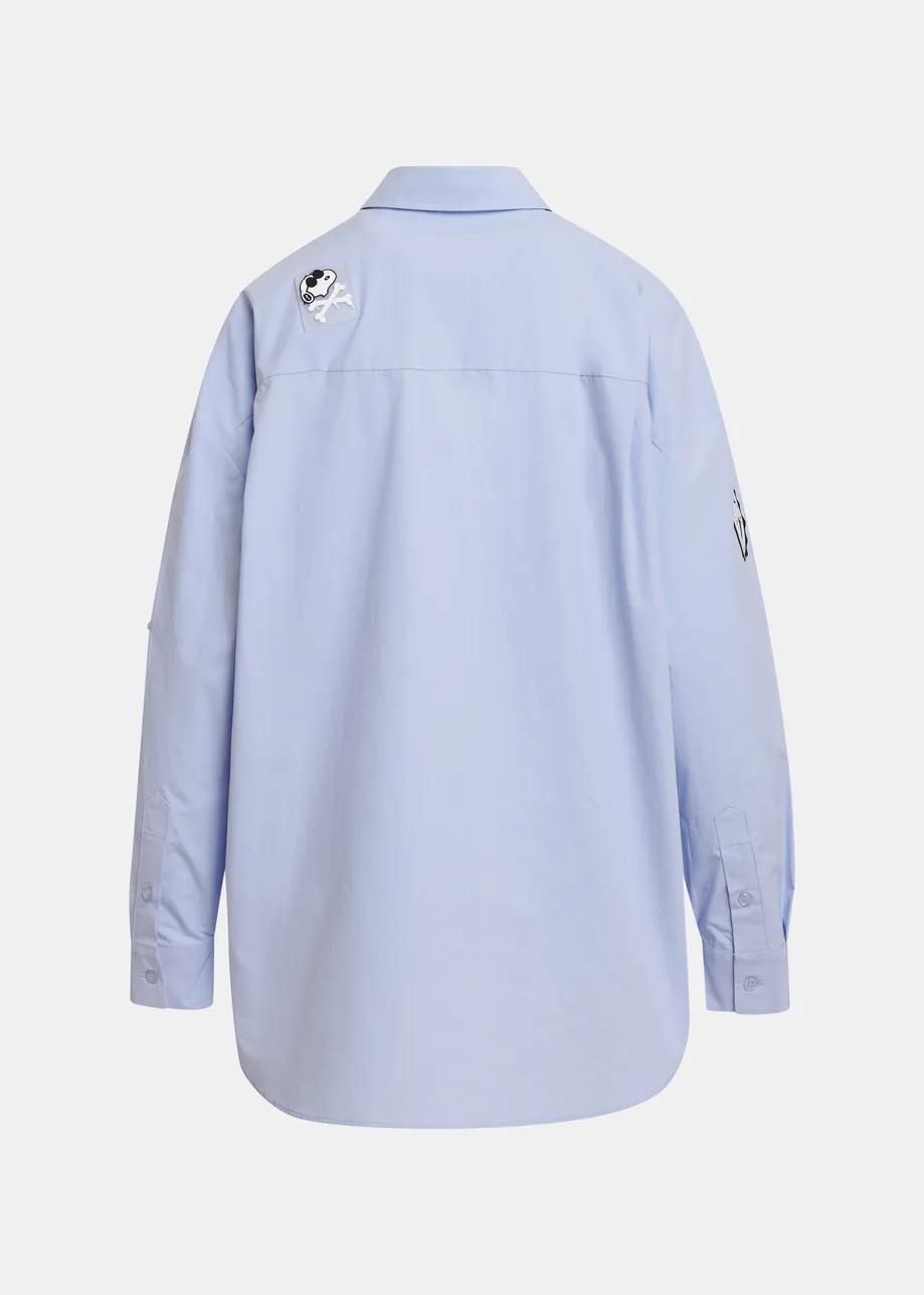 Light blue cotton shirt with multicolored Peanuts™ Snoopy patches