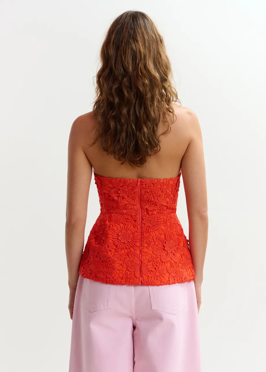 Oranje peplumtop in bloemenkant met halternek