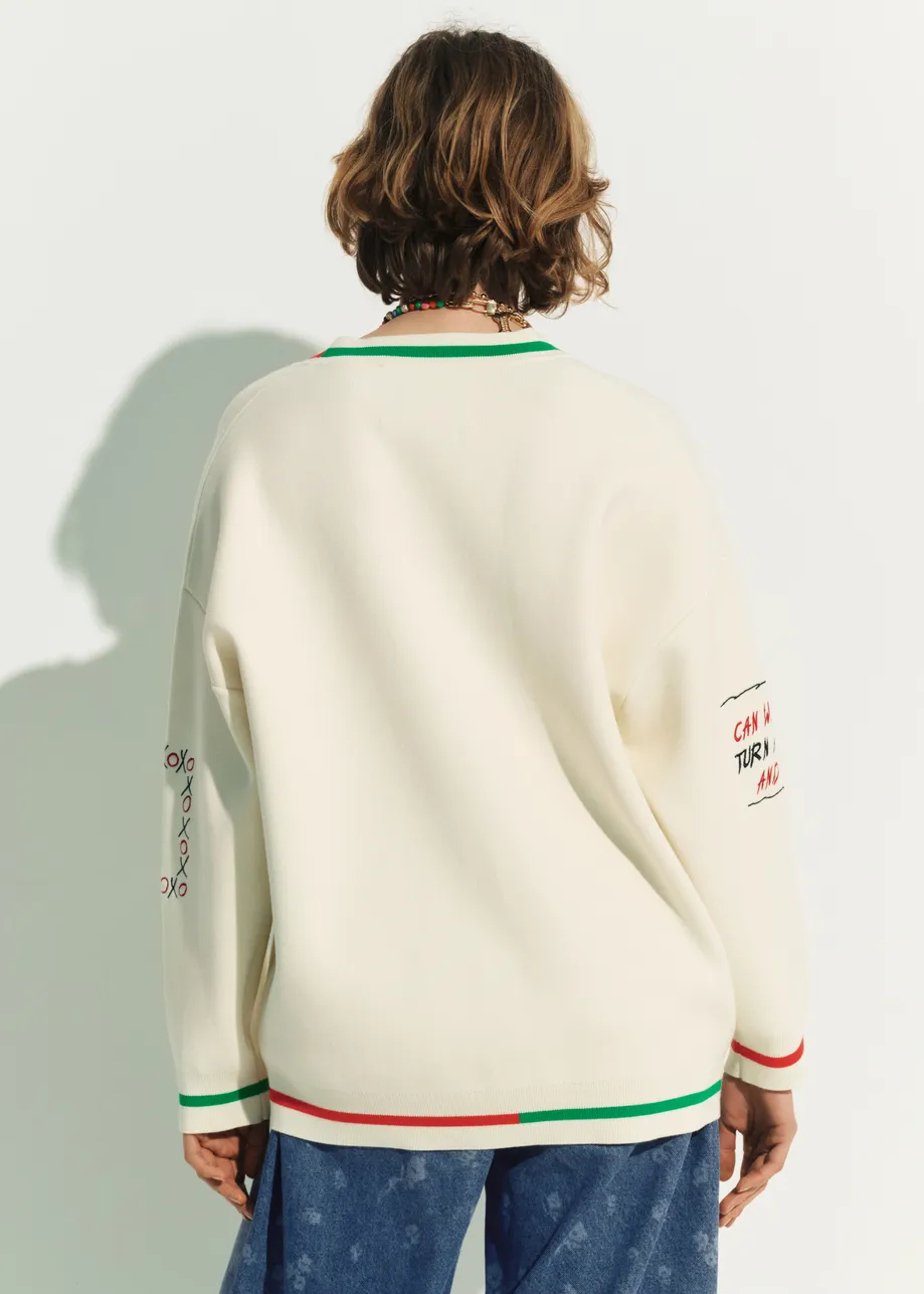 Off-white knit cardigan with multicolored Peanuts™ Snoopy and Woodstock patches