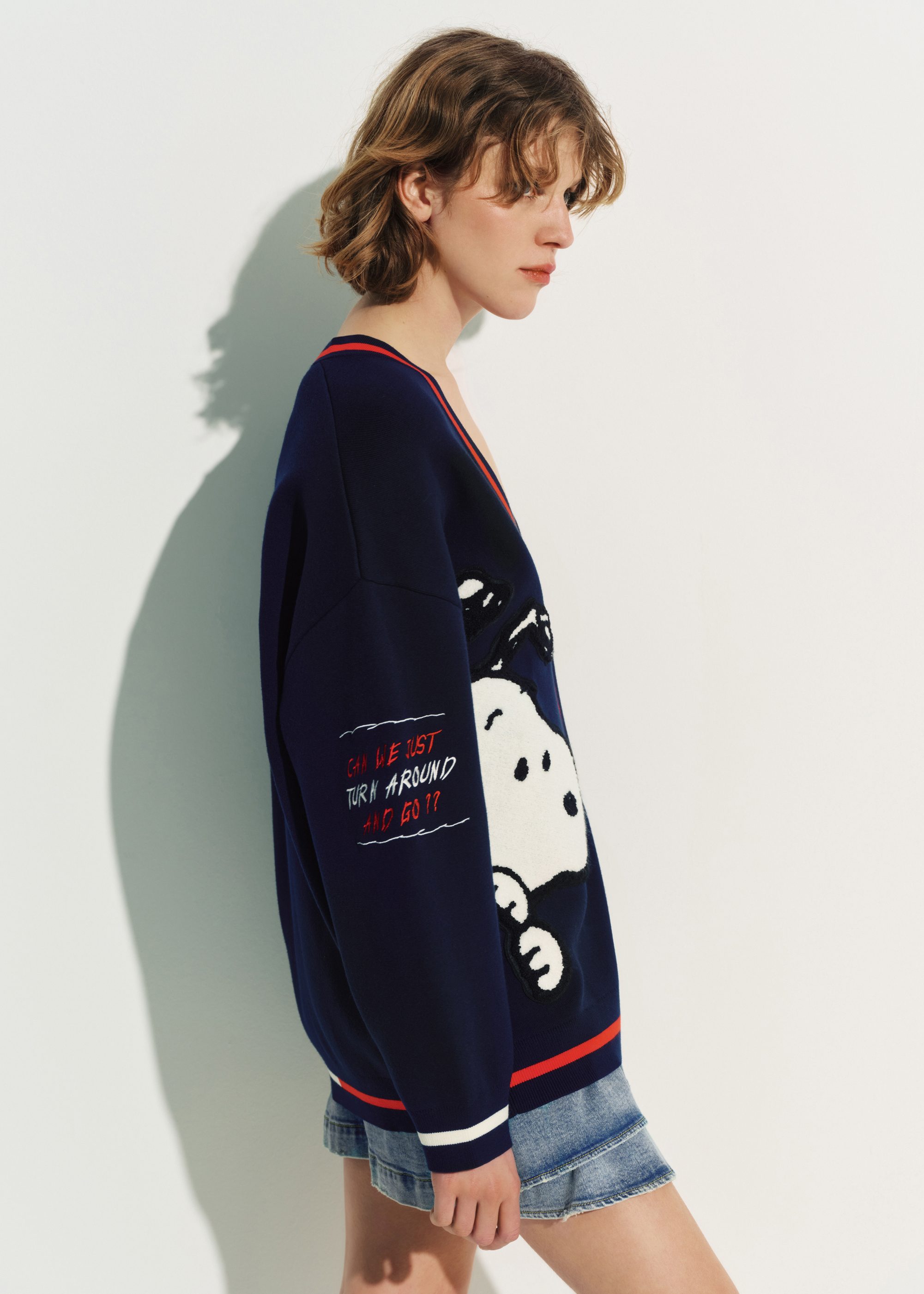 Navy knit cardigan with multicolored Peanuts™ Snoopy and Woodstock
