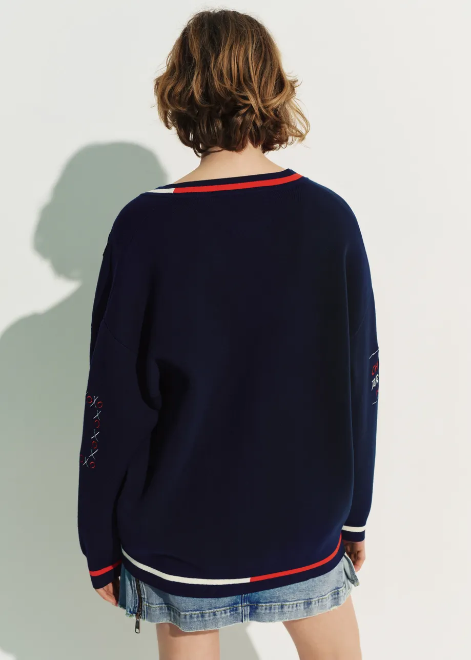 Navy knit cardigan with multicolored Peanuts™ Snoopy and Woodstock patches