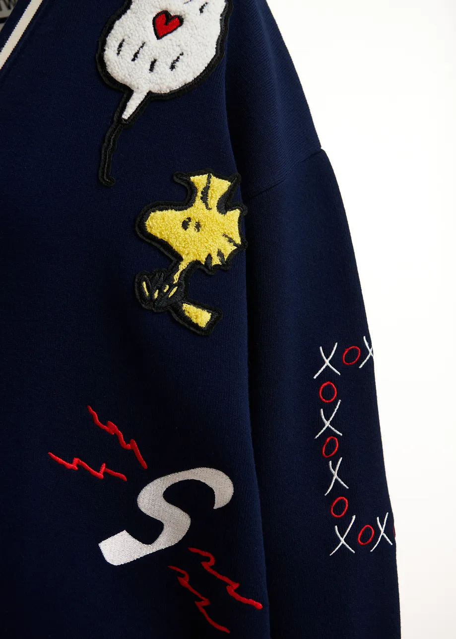 Navy knit cardigan with multicolored Peanuts™ Snoopy and Woodstock patches