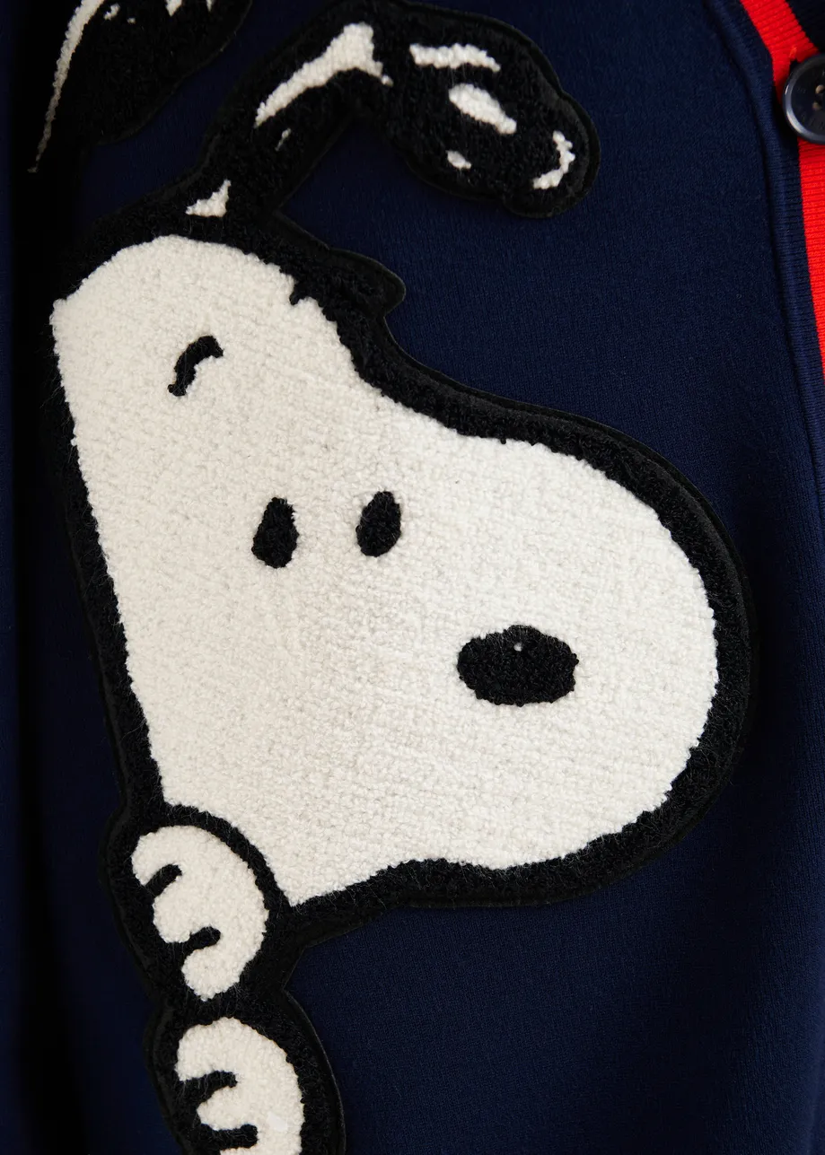 Navy knit cardigan with multicolored Peanuts™ Snoopy and Woodstock patches