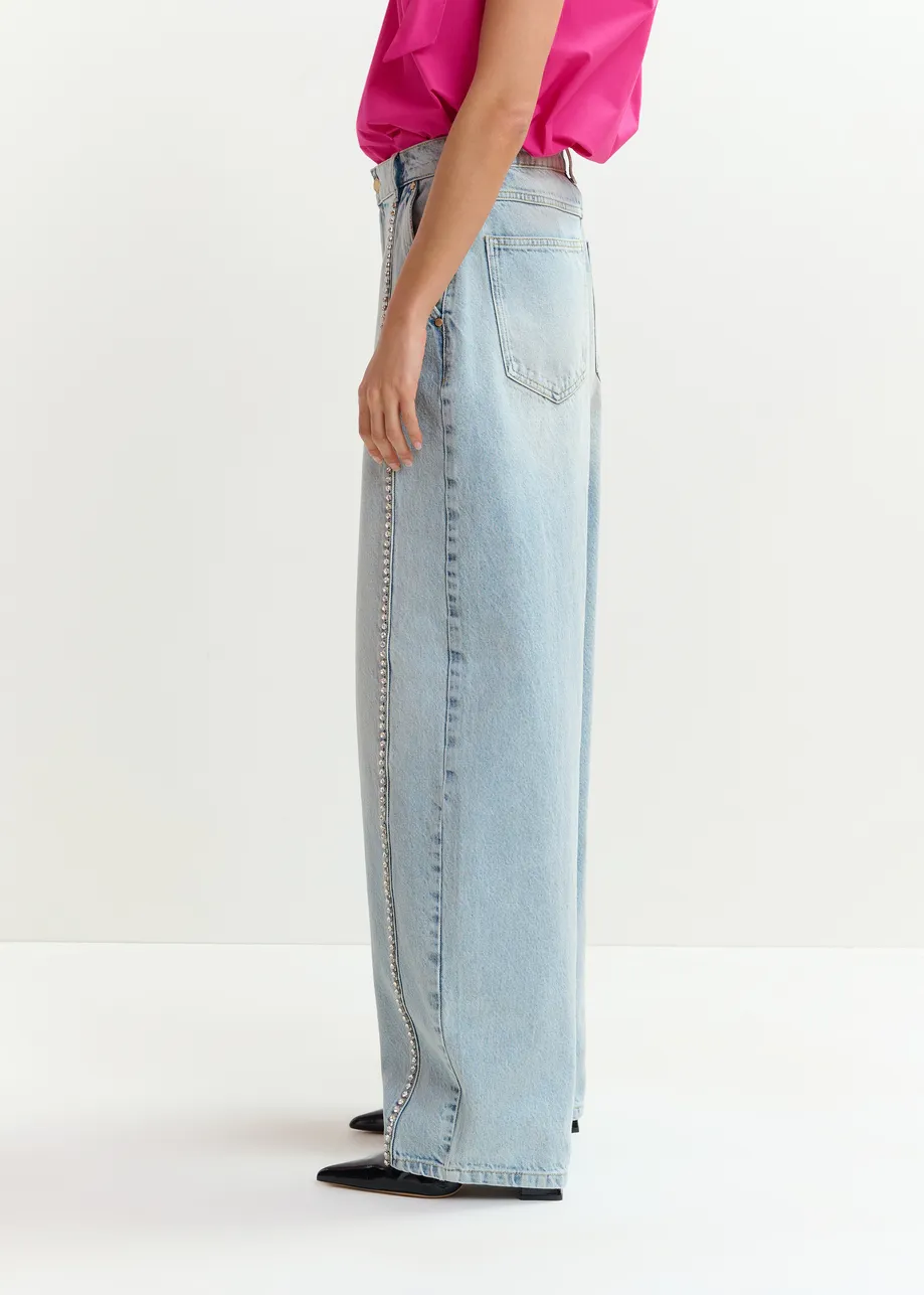 Light blue balloon-leg jeans with silver rhinestone side trim