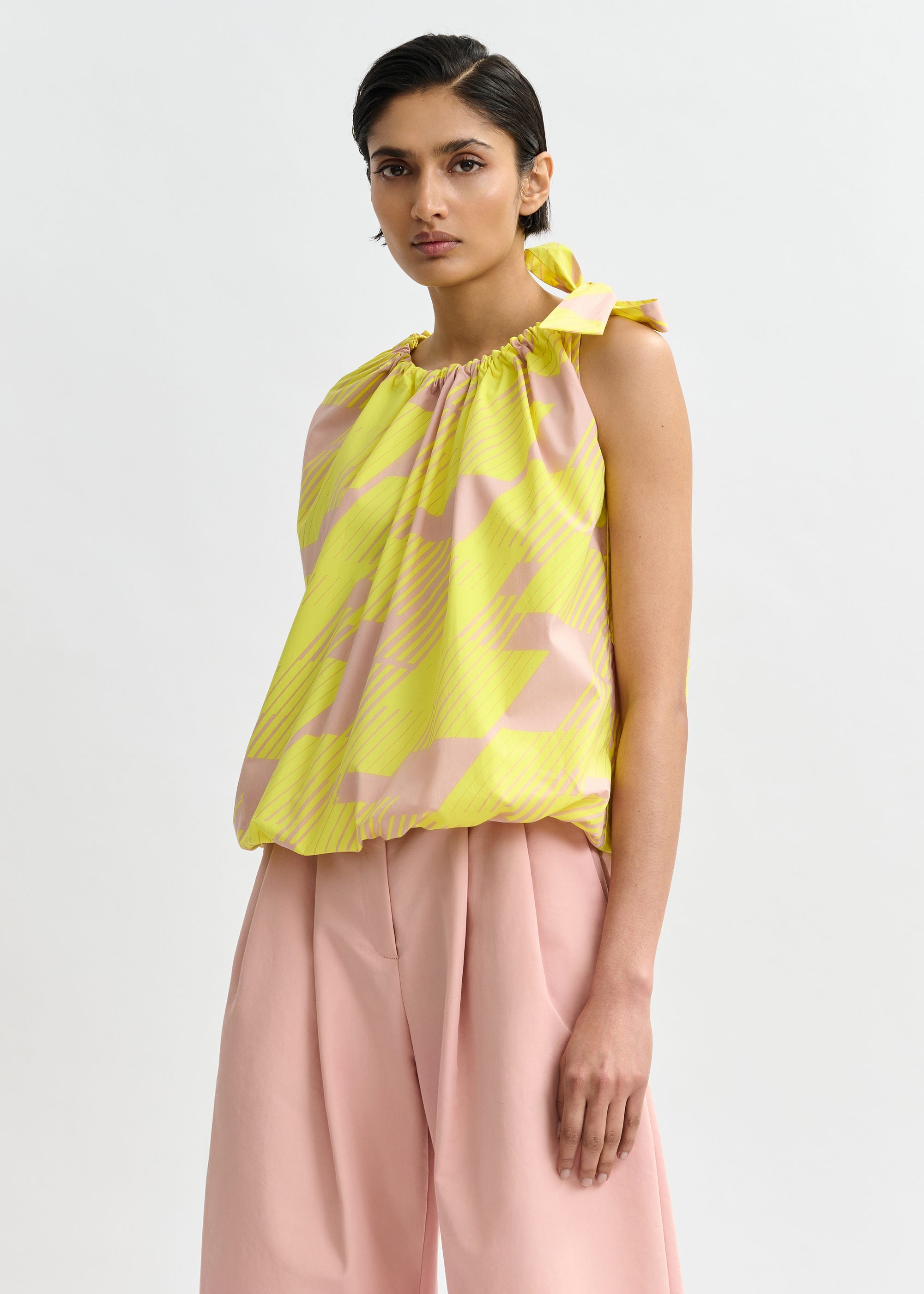 Light pink and yellow asymmetric top with neck tie ribbon Light pink and yellow asymmetric top with neck tie ribbon