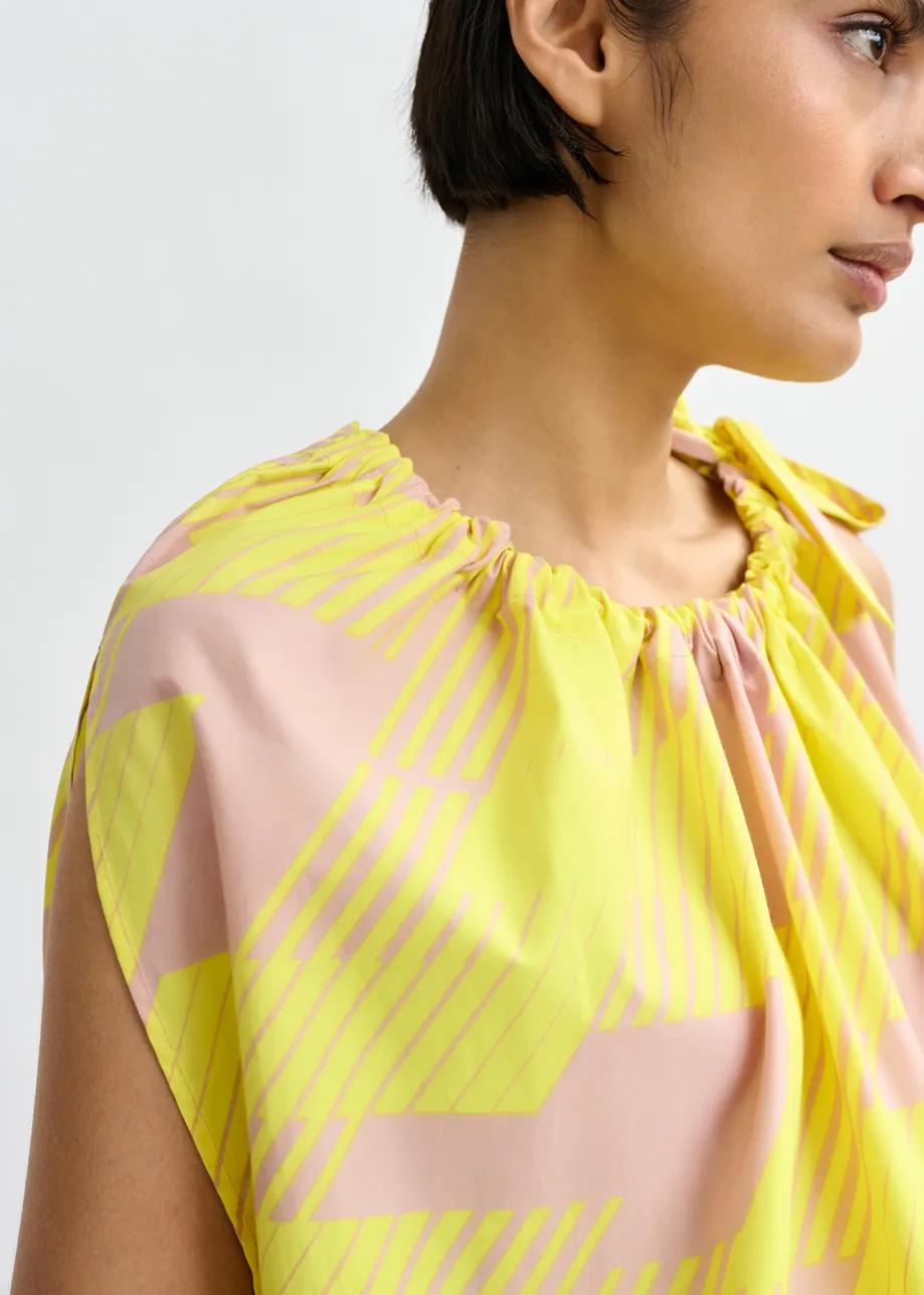 Light pink and yellow asymmetric top with neck tie ribbon