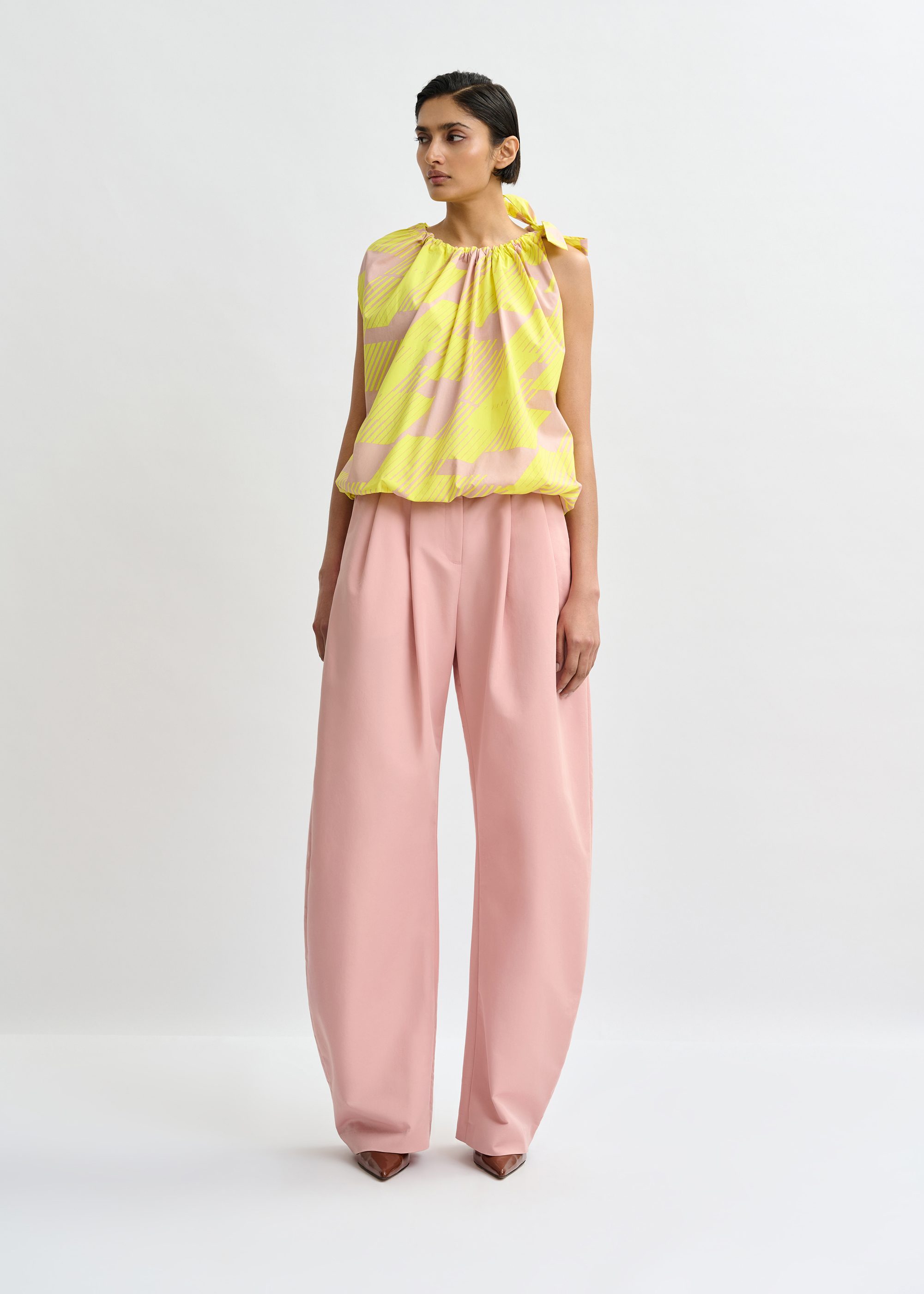 Light pink and yellow asymmetric top with neck tie ribbon