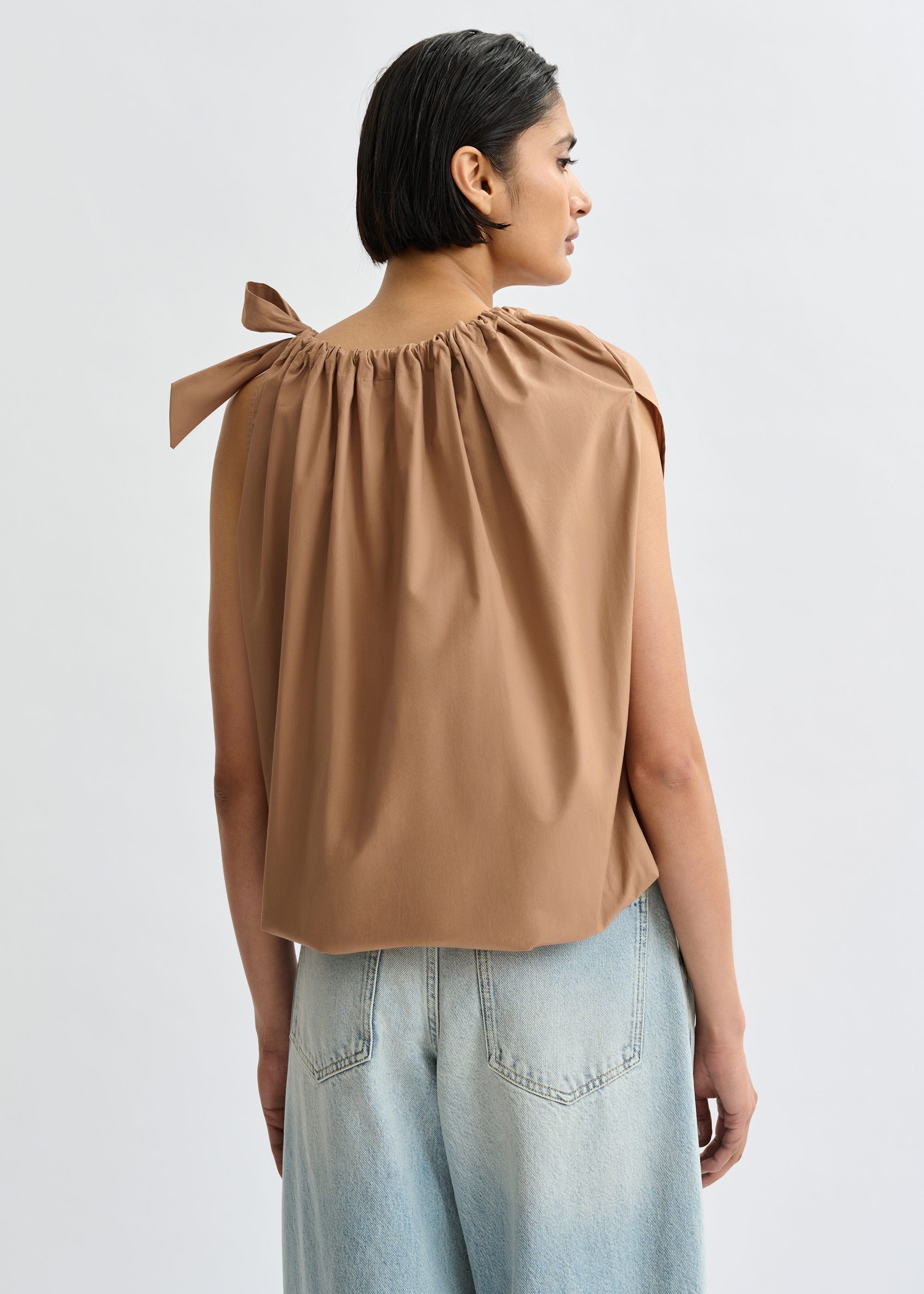 Brown asymmetric top with neck-tie ribbon | Essentiel Antwerp
