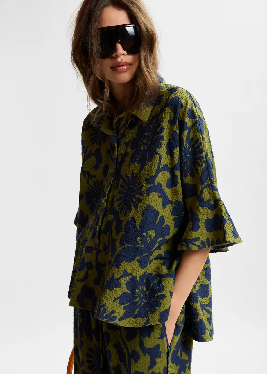 Green and dark blue peplum cotton shirt with contrasting collar