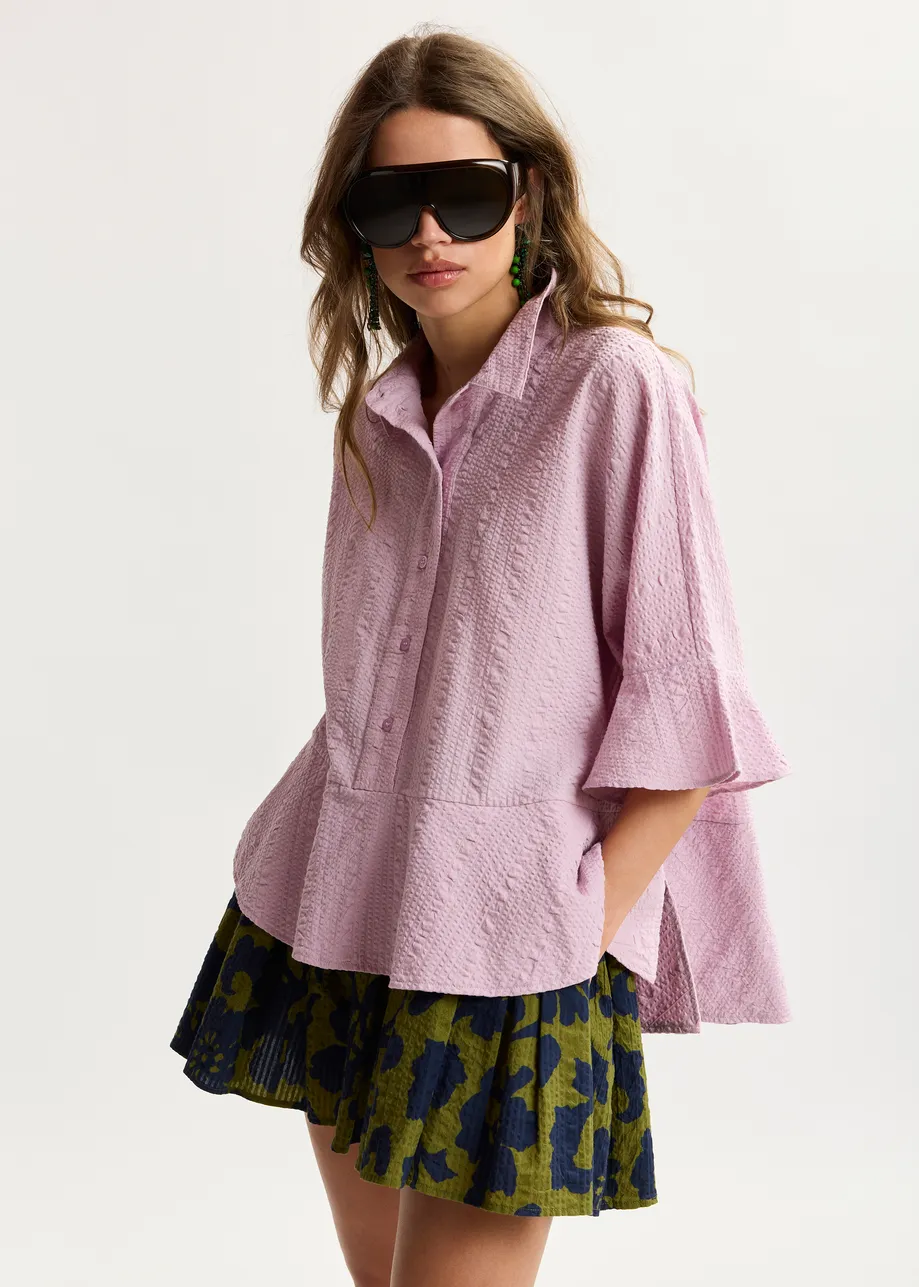 Light pink peplum cotton shirt with contrasting collar