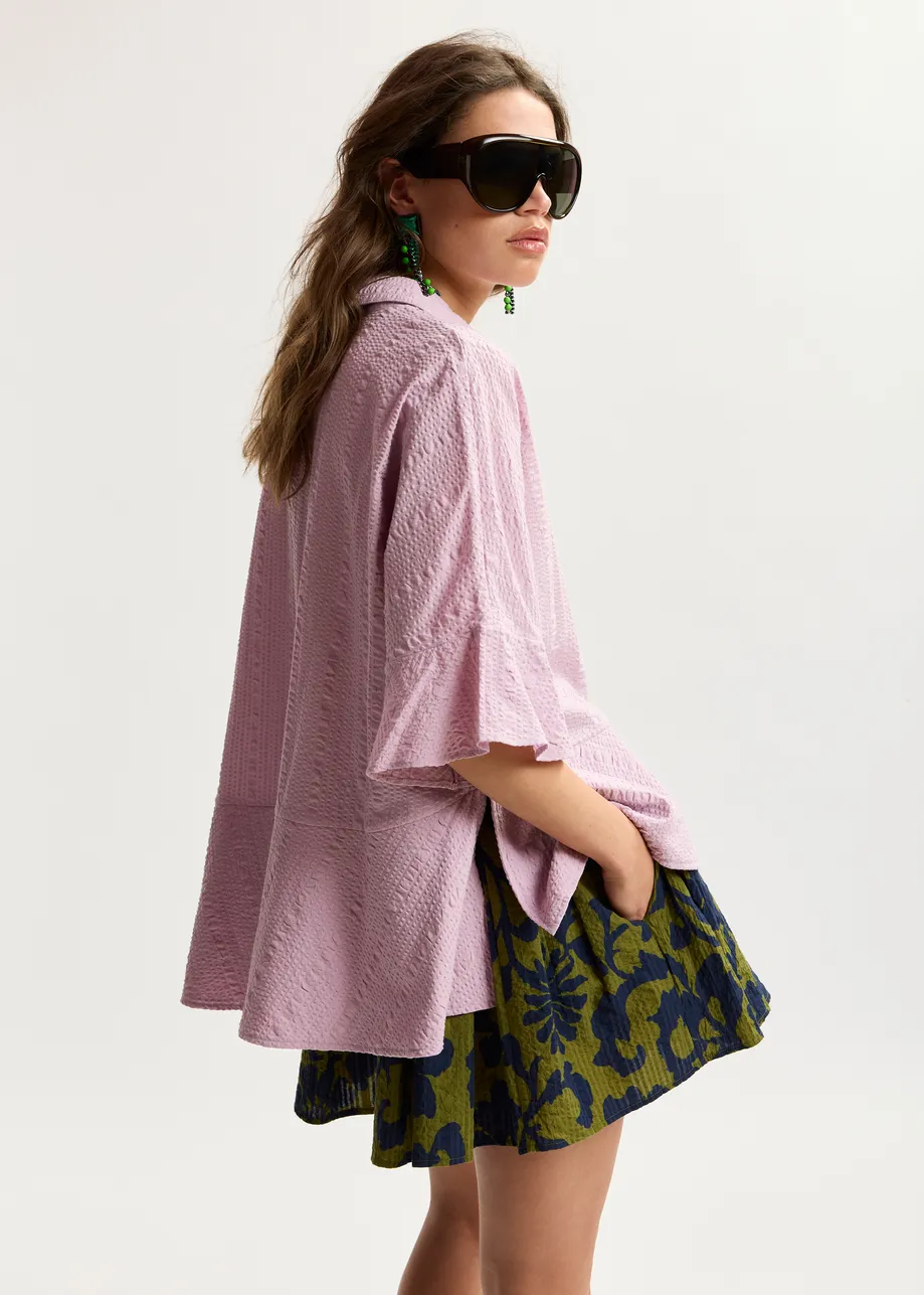 Light pink peplum cotton shirt with contrasting collar