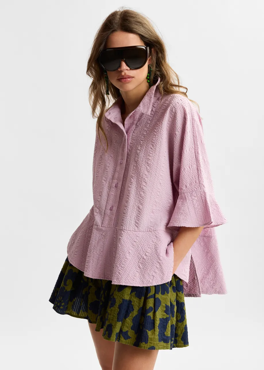 Light pink peplum cotton shirt with contrasting collar