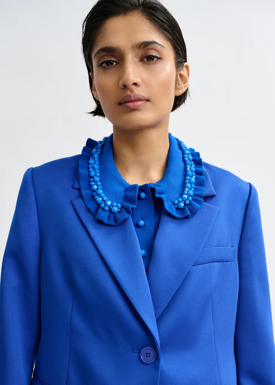 Blauwe blazer met enkele knopenrij