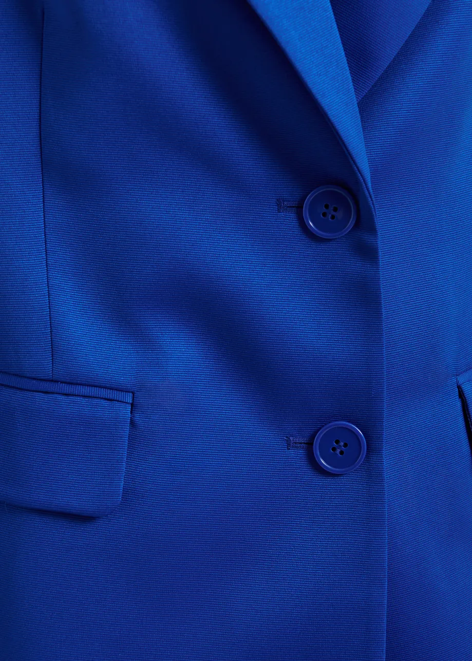 Blauwe blazer met enkele knopenrij
