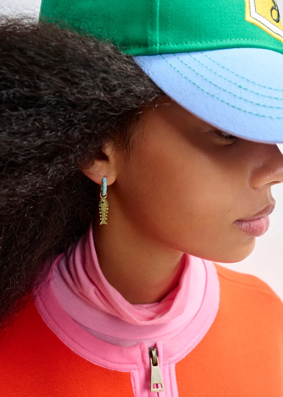 Light blue and gold hoop earrings with bear and fish bone pendants