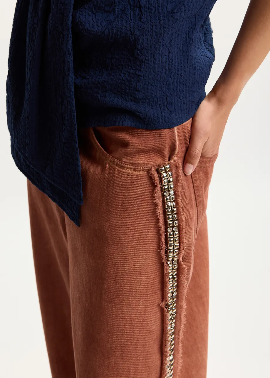 Terracotta wijde jeans met hoge taille en versierde zijnaden