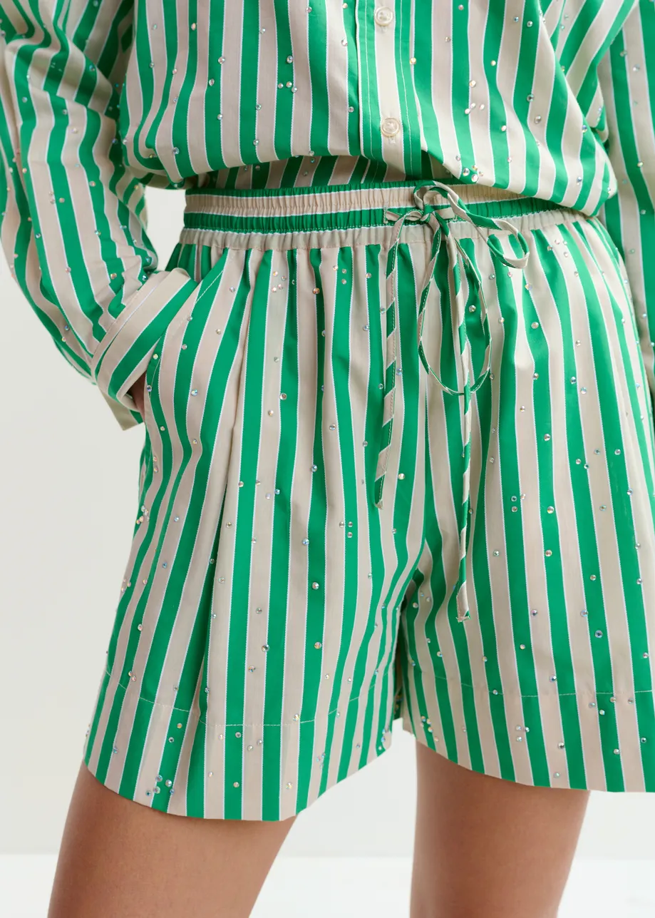 Green and cream striped shorts with rhinestone embellishments